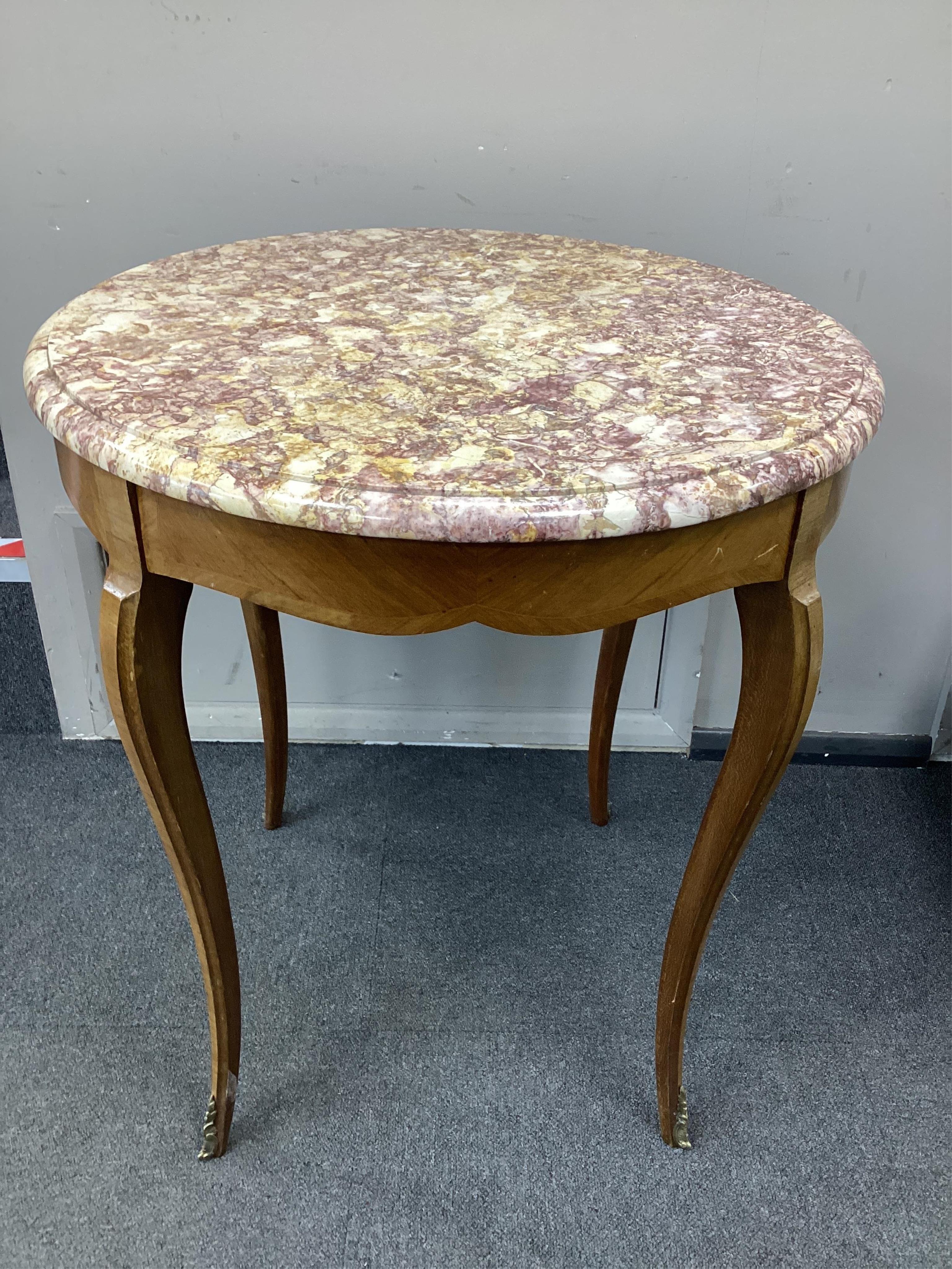 A Louis XVI style circular banded kingwood marble top centre table, diameter 65cm, height 71cm. Condition-good